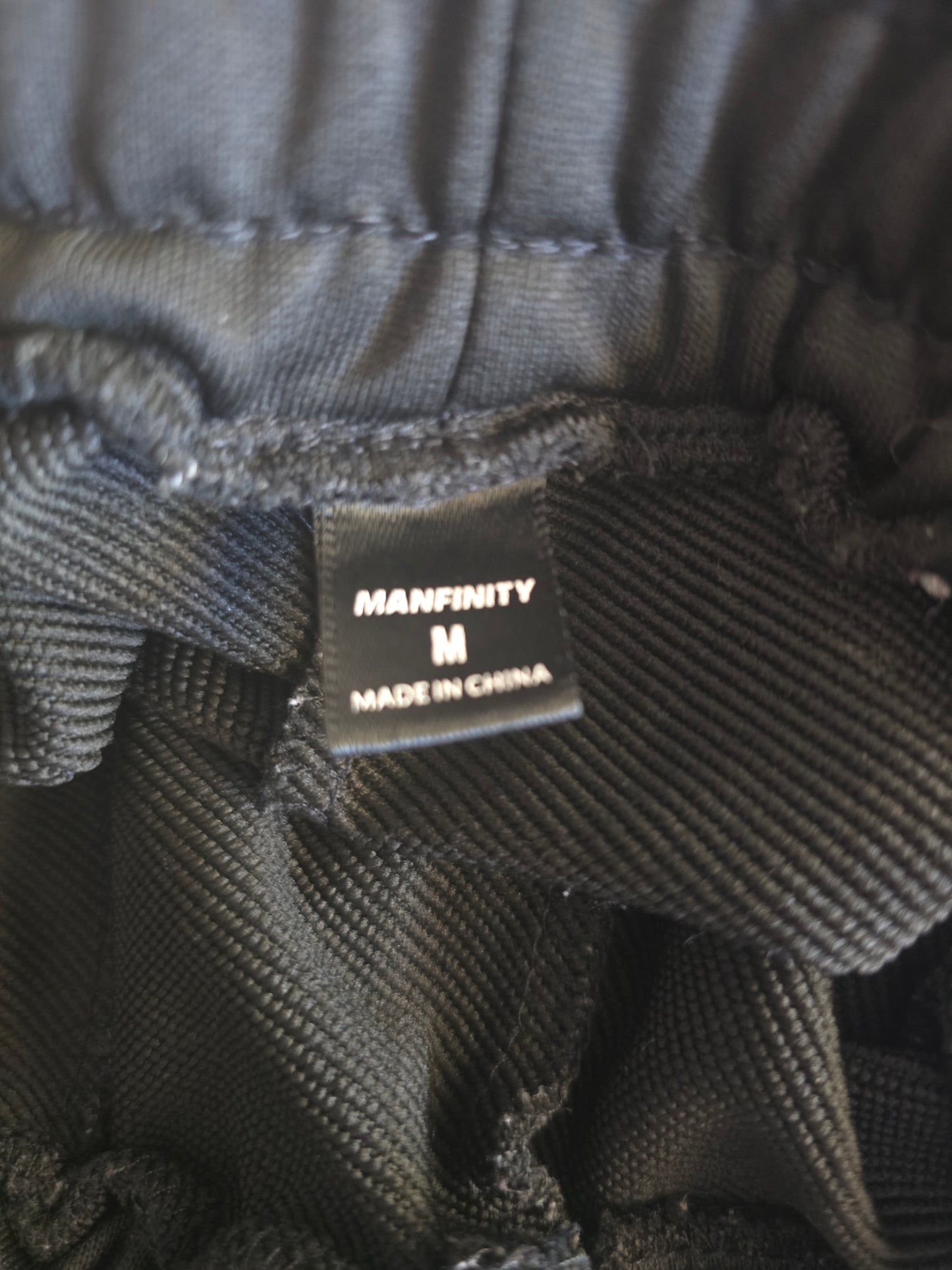 Edgy Comfort: Pre-Loved Manfinity Black Graphic Sweatpants (Men's Medium)